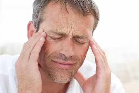 man suffering from TMJ pain